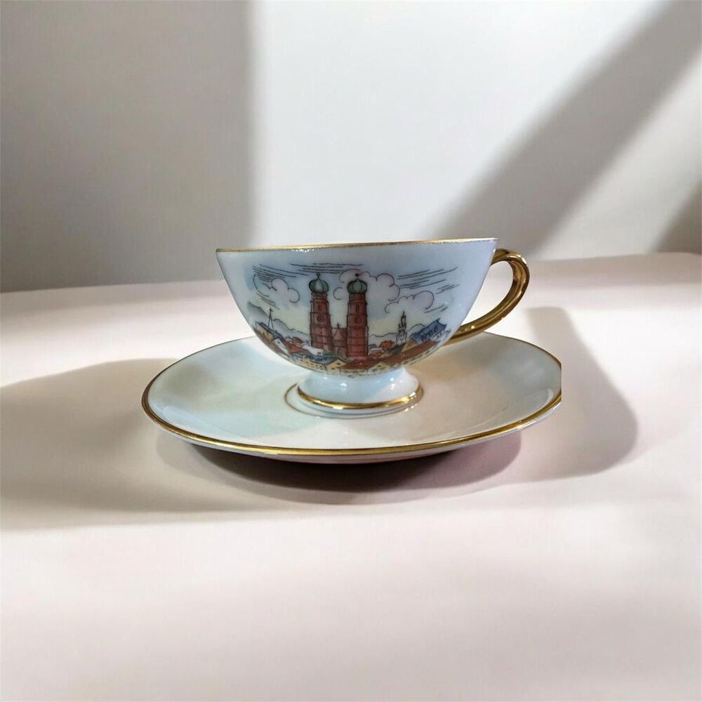 pmr bavaria jaeger co germany tea cup and saucer city theme, gold.